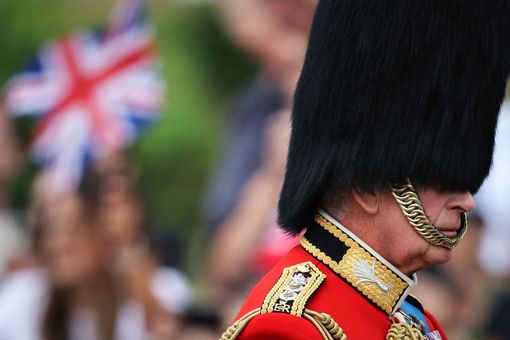 Britain's King Charles III leads on horseback 